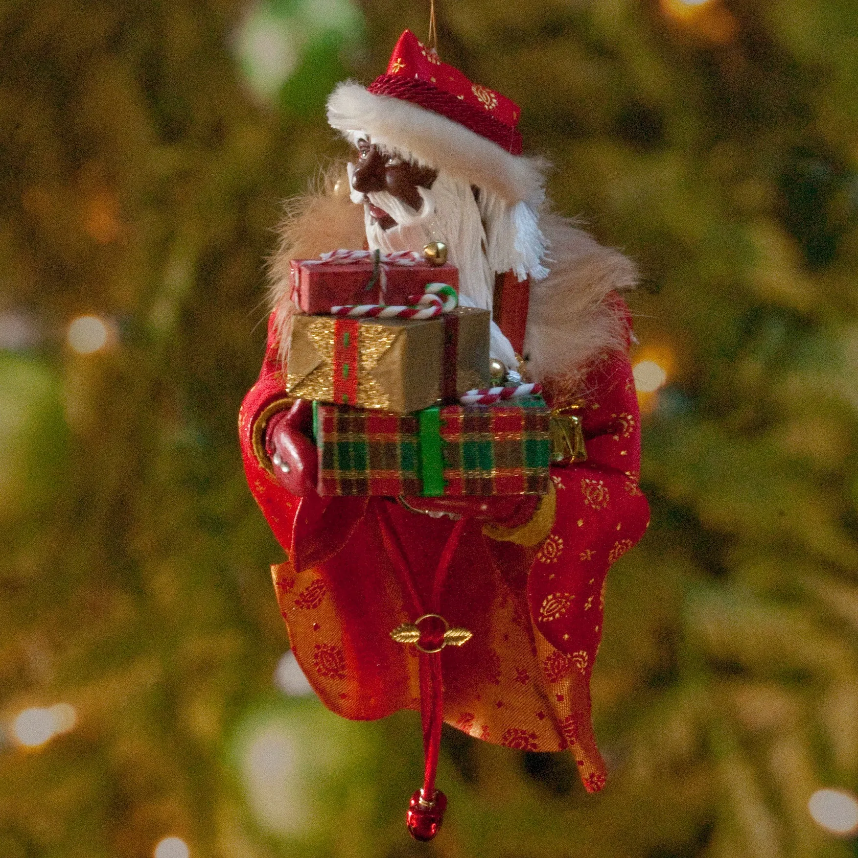 African American Santa Claus Decoration - Arm full of Christmas presents - Richly textured fur trimmed red and gold coat & cap - Golden mittens